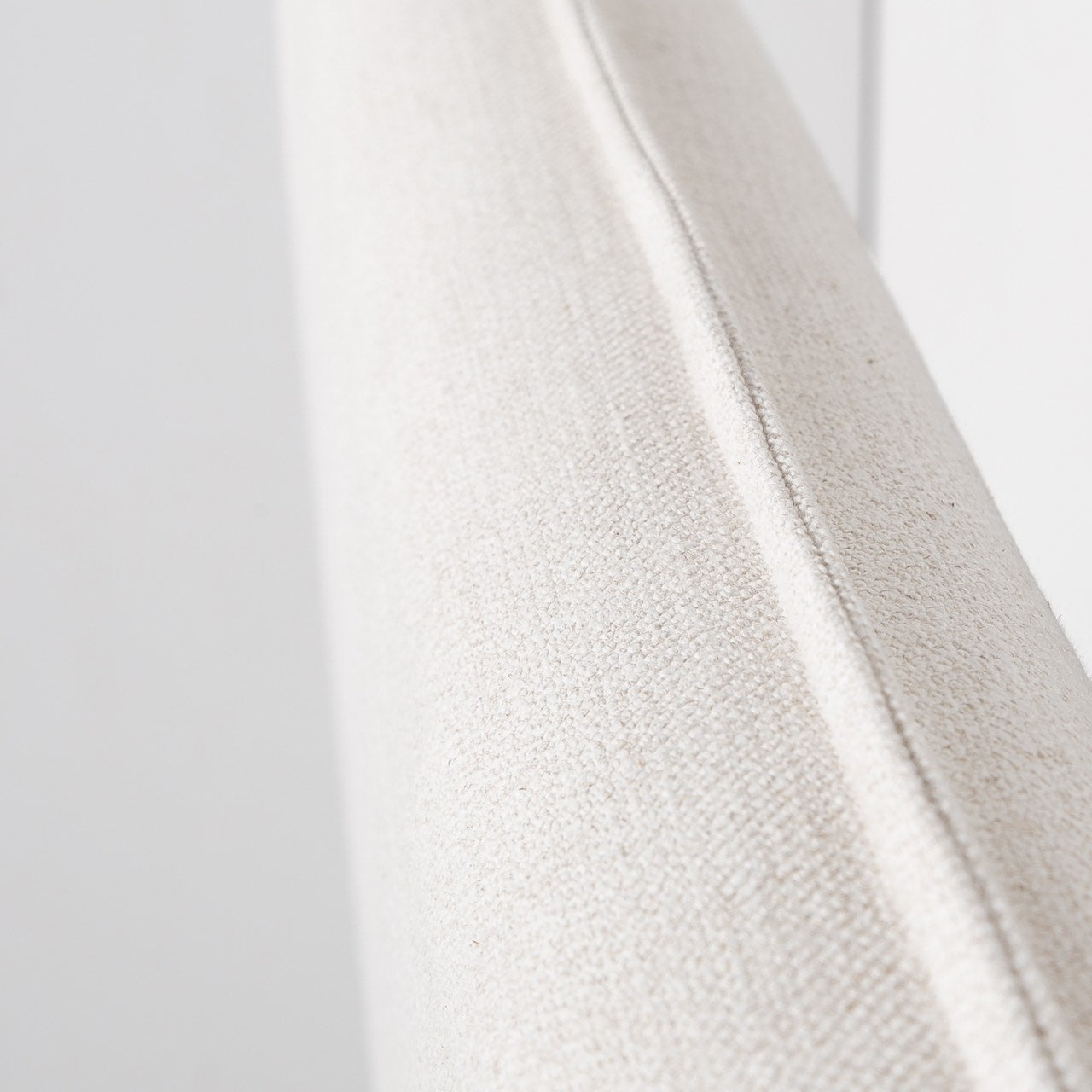 Front view highlighting the soft textured upholstery and the clean architectural lines of the bed frame
