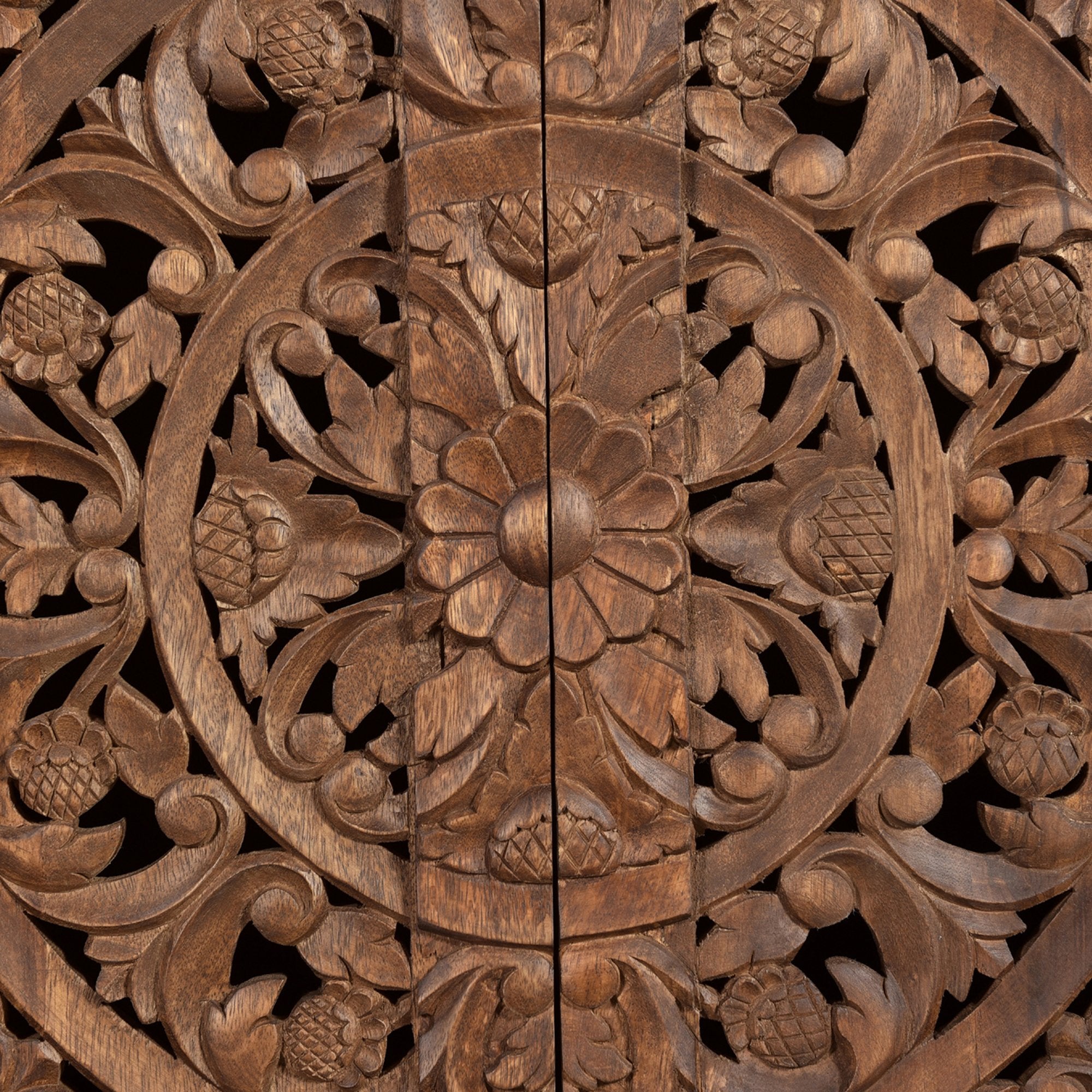 Straight-on front view of the Carved sideboard featuring a rich natural wood finish and intricate floral mandala carvings across four doors