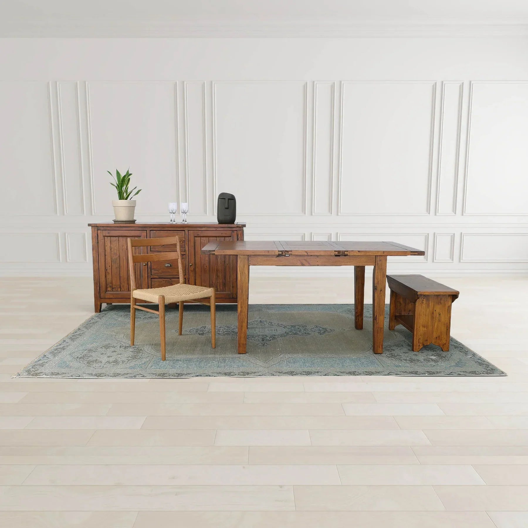 Direct front perspective showcasing the thick wood top and sturdy pedestal-style legs of the African Dusk bench