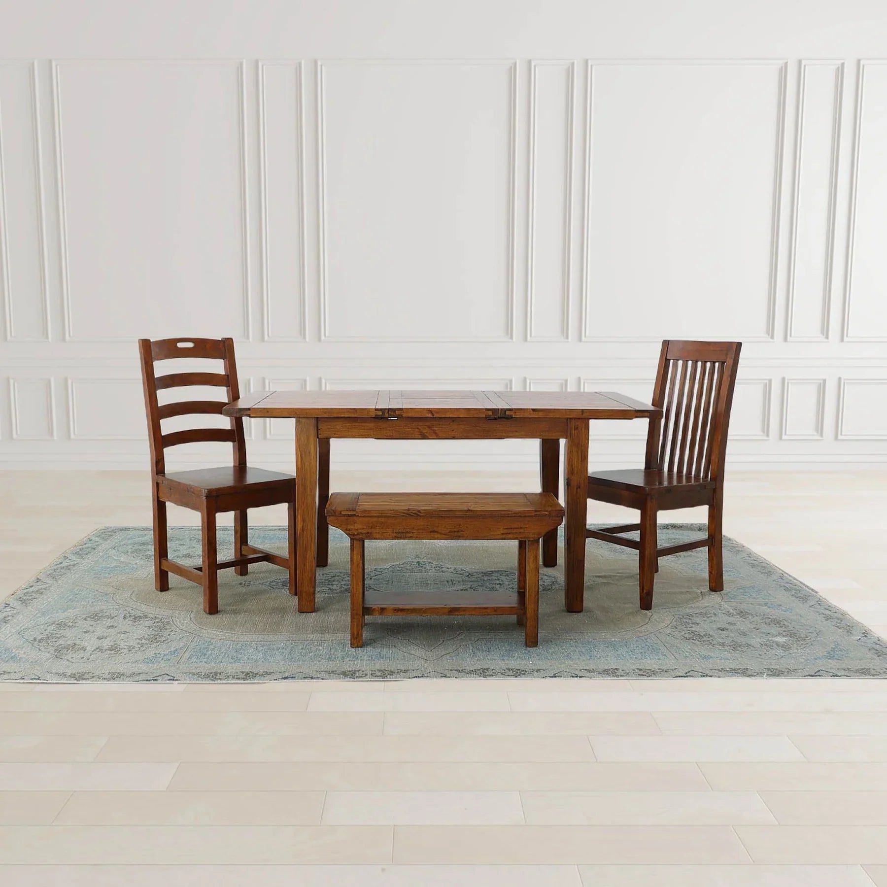 Direct front perspective showcasing the thick wood top and sturdy pedestal-style legs of the African Dusk bench