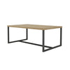 Perspective view highlighting the elongated rectangular silhouette and the sturdy architectural steel base of the coffee table