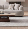Close-up of Isla 2-piece modular curved sofa in cream fabric in a modern living room setting