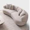 Isla 2-piece modular curved sofa in cream fabric shown in a modern living room lifestyle setting