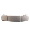 Back view of Isla 3-piece modular curved sofa in cream fabric with curved modular silhouette