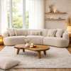 Isla 3-piece modular curved sofa in cream fabric styled in a bright modern living room setting