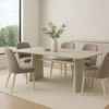 Itska ceramic top dining table styled in a modern dining room with upholstered chairs, minimalist travertine-look table for contemporary interiors