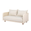 Three-quarter angled view of the Ivory Coast loveseat showcasing the texture of the weather-resistant wicker