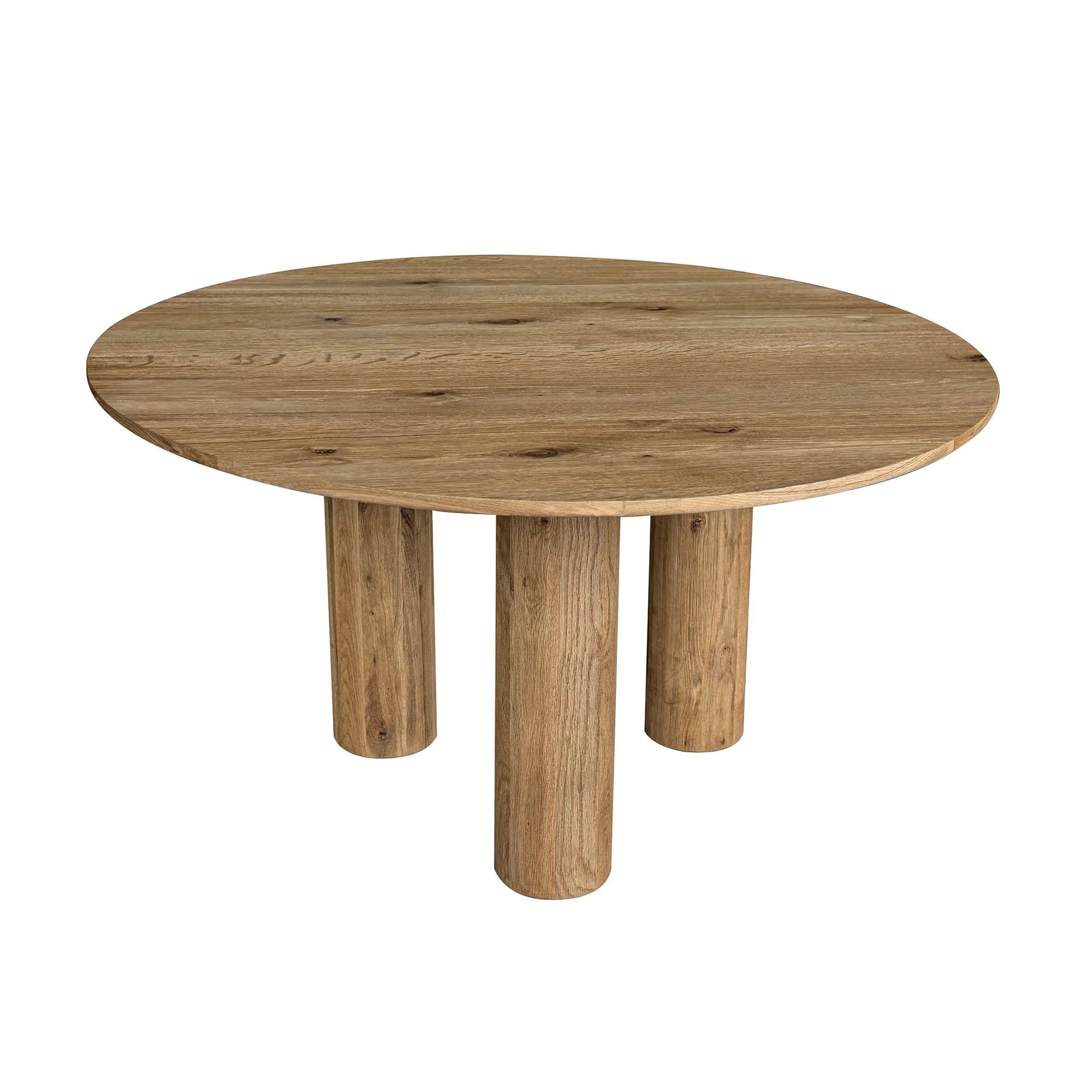 Three-quarter perspective view of the Jasper round dining table in a natural oak finish featuring three thick cylindrical pedestal legs