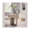 Lifestyle shot of the Jorlaina table styled with a vase and modern decor in a bright contemporary interior to demonstrate scale