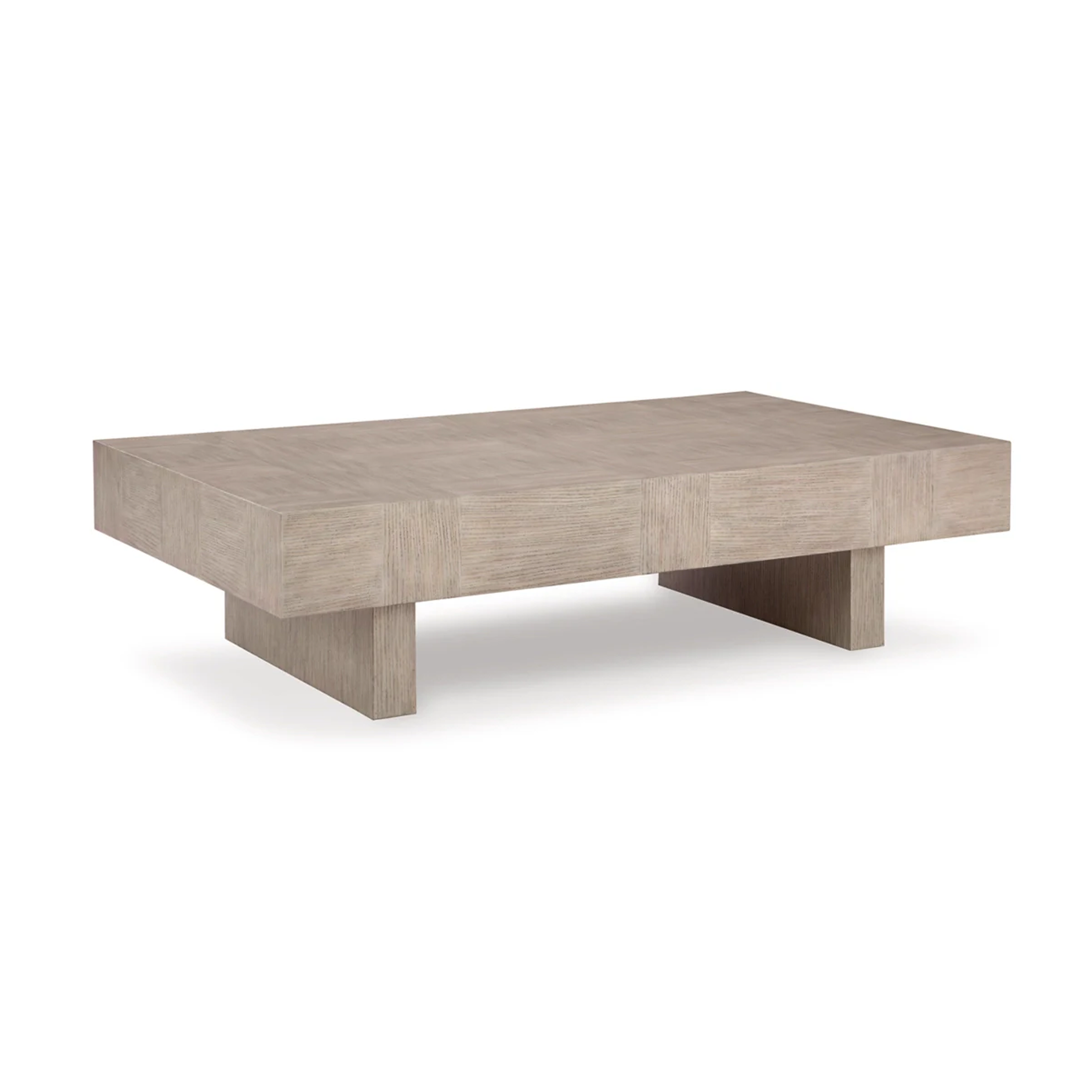 Three-quarter perspective highlighting the substantial block silhouette and the recessed plinth base of the Jorlaina table