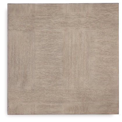 Direct overhead view showcasing the unique parquetry-style wood grain patterns on the square tabletop surface