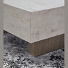 Close-up shot focusing on the crisp corner joinery and the textured wood grain of the light grey block top