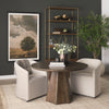 Lifestyle perspective of the round table styled as a small meeting or dining table in a contemporary office setting