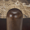 Top-down detail shot of the cylindrical mango wood leg cap extending above the cappuccino marble top