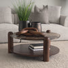 Lifestyle shot featuring the Jovia marble coffee table styled with decorative chain links in a contemporary seating area