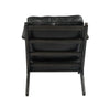 Junior arm chair in black leather styled in living room