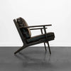 Junior arm chair in black leather in contemporary living room