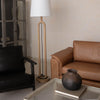 Junior arm chair in black leather in modern interior setting