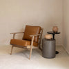 Junior arm chair in brown leather styled in living room