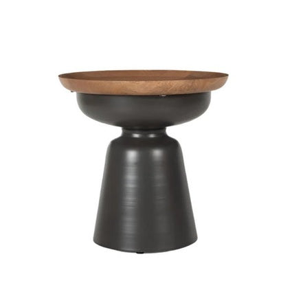 Front view of the Kana side table featuring a shallow natural mango wood bowl top on a tapered matte black metal pedestal base