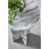 Perspective shot highlighting the architectural interlocking stone panels that form the sturdy pedestal base