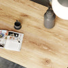 Perspective view of the Kenzo table in the dark walnut finish variant showcasing its moody and sophisticated look