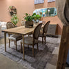 Perspective view of the Kenzo table in a medium brown wood tone variant showcasing the versatile color options