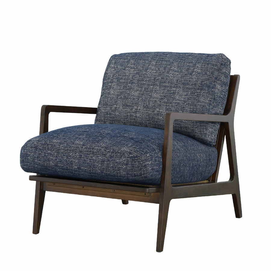 Three-quarter view highlighting the blue upholstery and curved wooden arms