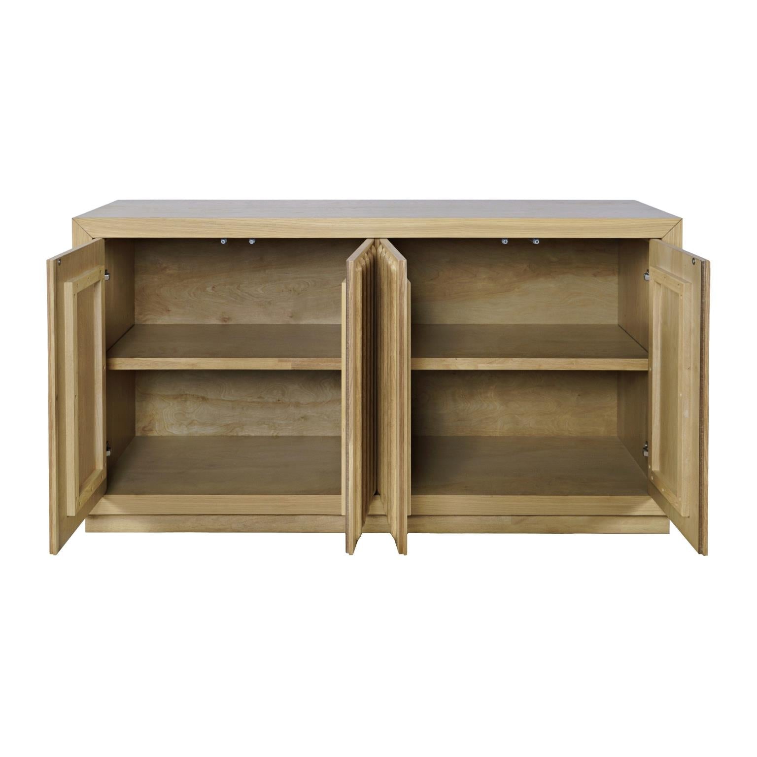 Front perspective view of the Skap 4-door sideboard in a dark oak finish featuring vertical fluted door panels and a matching plinth base