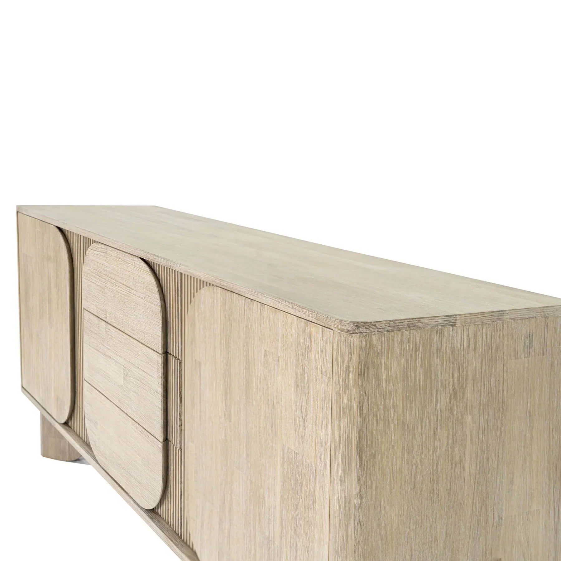 Front perspective view of the Haru sideboard in a light oak finish featuring unique rounded door and drawer panels with a minimalist plinth base