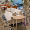 Close-up lifestyle view of the table used as a sofa-side companion in a contemporary home