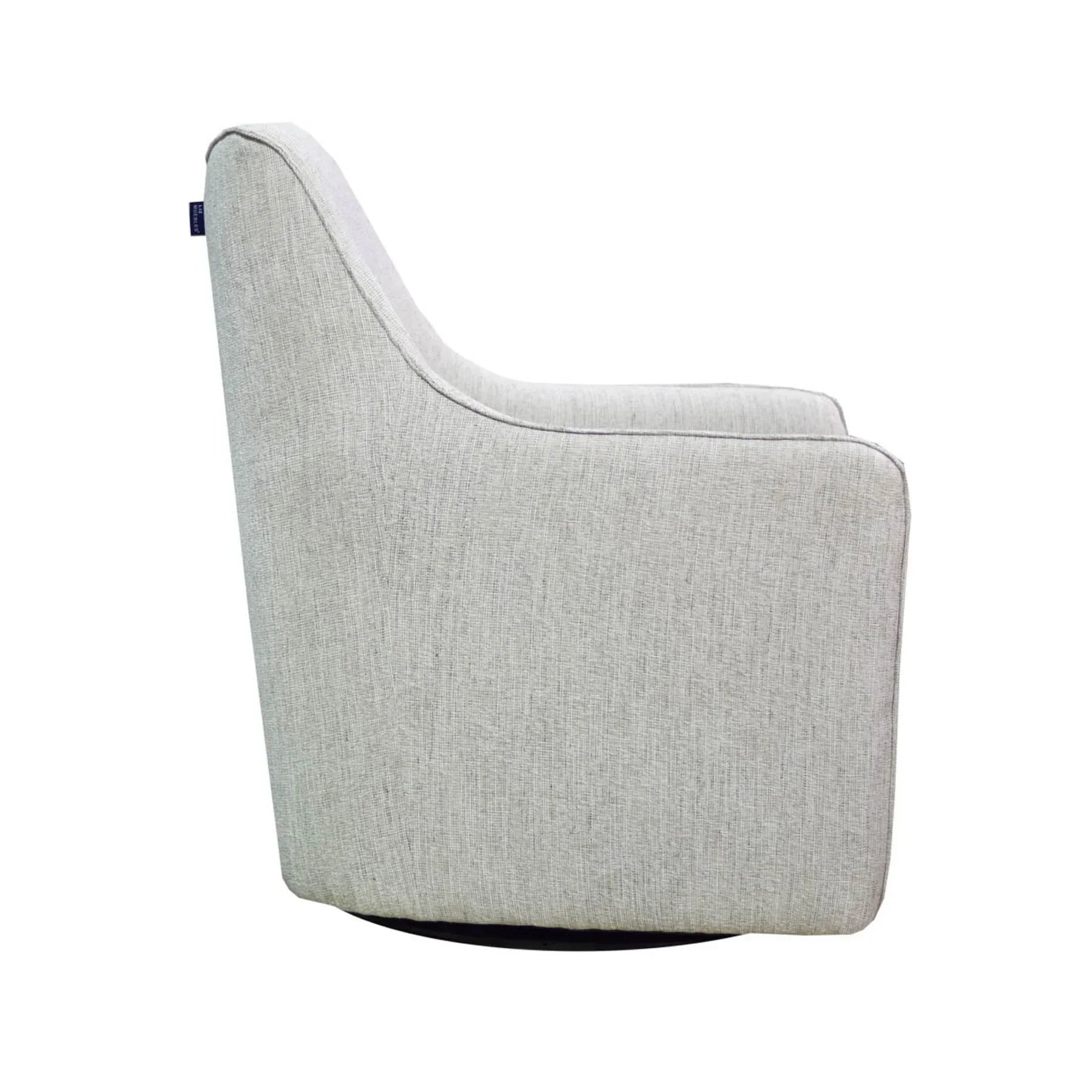 Side profile showcasing the clean lines and low-profile swivel base of the Lilith armchair