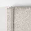 Close-up shot focusing on the high-quality tailoring and seamless fabric transition of the dune wingback headboard