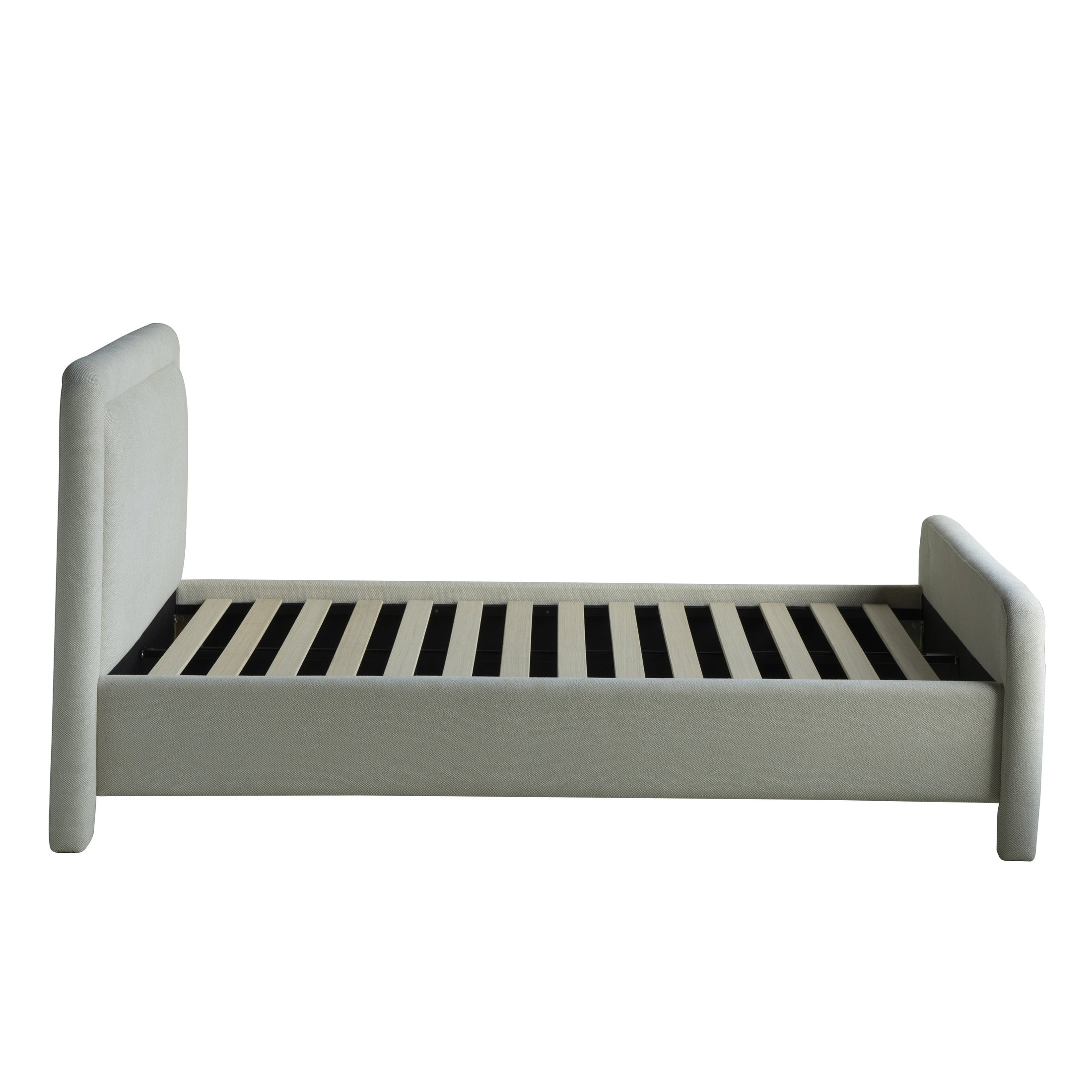 Side profile view showcasing the slender depth of the cushioned headboard and the consistent rounded frame aesthetic
