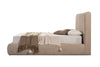 Side profile view showcasing the low-profile rounded bed base and the elegant height of the cushioned headboard