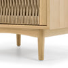 Close-up perspective of the lower frame highlighting the elegant curved support beam and stable tapered wood legs