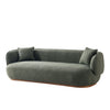 Dark grey curved boucle sofa with two cushions and wooden base isolated on a white background