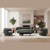 Modern living room featuring a dark green curved boucle sofa set with matching armchairs and minimalist coffee table on a neutral rug