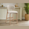 Lifestyle shot of the Luna counter stool styled in a modern, bright kitchen area