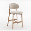 Three-quarter angle view of the Luna natural oak counter stool in beige