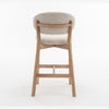 Rear view of the Luna counter stool showing the natural oak grain and tapered legs