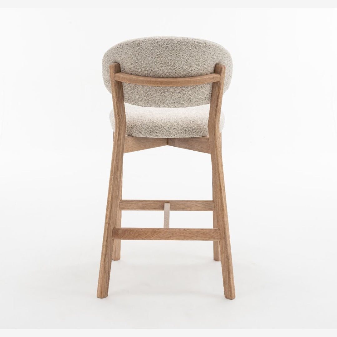 Luna counter stool with beige textured upholstery and natural oak wood frame