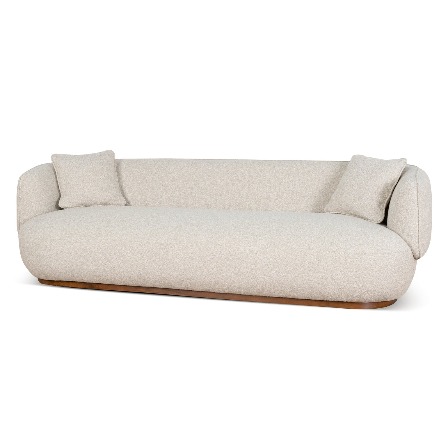 Luna Premium Boucle Sofa with two pillows in cream boucle fabric, curved modern design with low wooden base, angled view