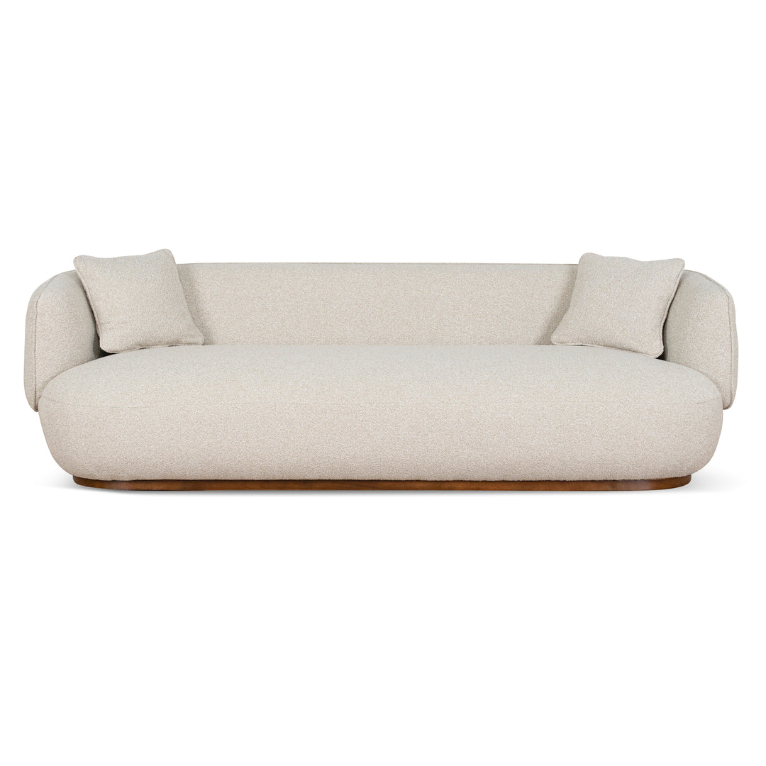 Luna Premium Boucle Sofa with two pillows in cream boucle fabric with curved modern silhouette and wooden base