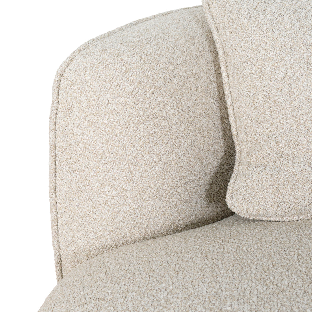 Close-up of Luna Premium Boucle Sofa curved armrest and cream boucle upholstery texture with matching pillow