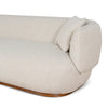 Detail view of Luna Premium Boucle Sofa showing curved armrest, cream boucle upholstery, and matching throw pillow