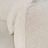 Close-up of Luna Premium Boucle Sofa showing textured cream boucle upholstery and soft rounded armrest detail