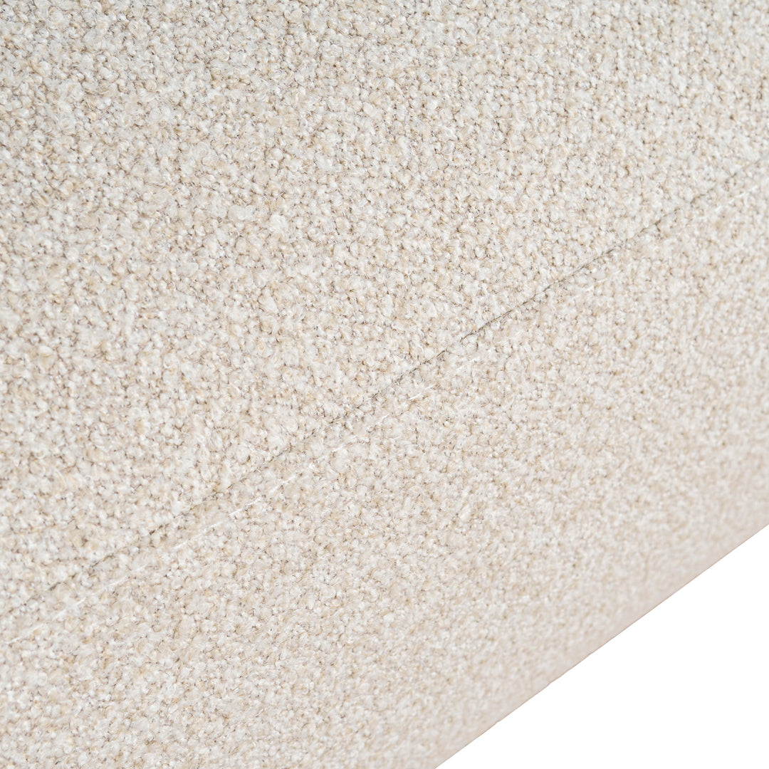Close-up of cream boucle fabric texture on Luna Premium Boucle Sofa showing soft looped upholstery and seam detail