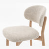 Close-up view of the rounded upholstered seat on the Luna counter stool