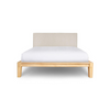 Front view of the Luna double bed featuring a solid walnut wood frame and a low-profile textured sand headboard